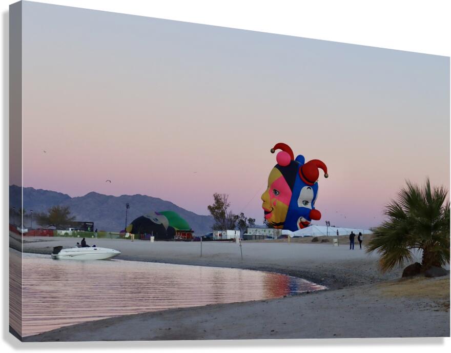 Balloons on the beach at sunrise Canvas Print